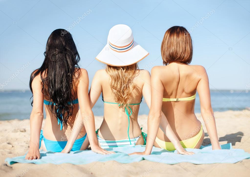 depositphotos 29513529 stock photo girls sunbathing on the beach