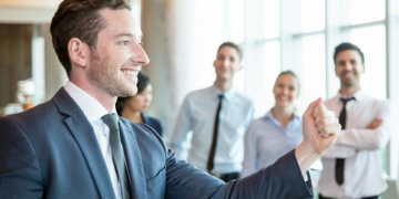 cheerful leader motivating his business team 1262 3713