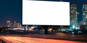Billboard street on light trails for outdoor advertising poster or blank billboard at night time for advertisement. street light.- can for display or montage product or business.