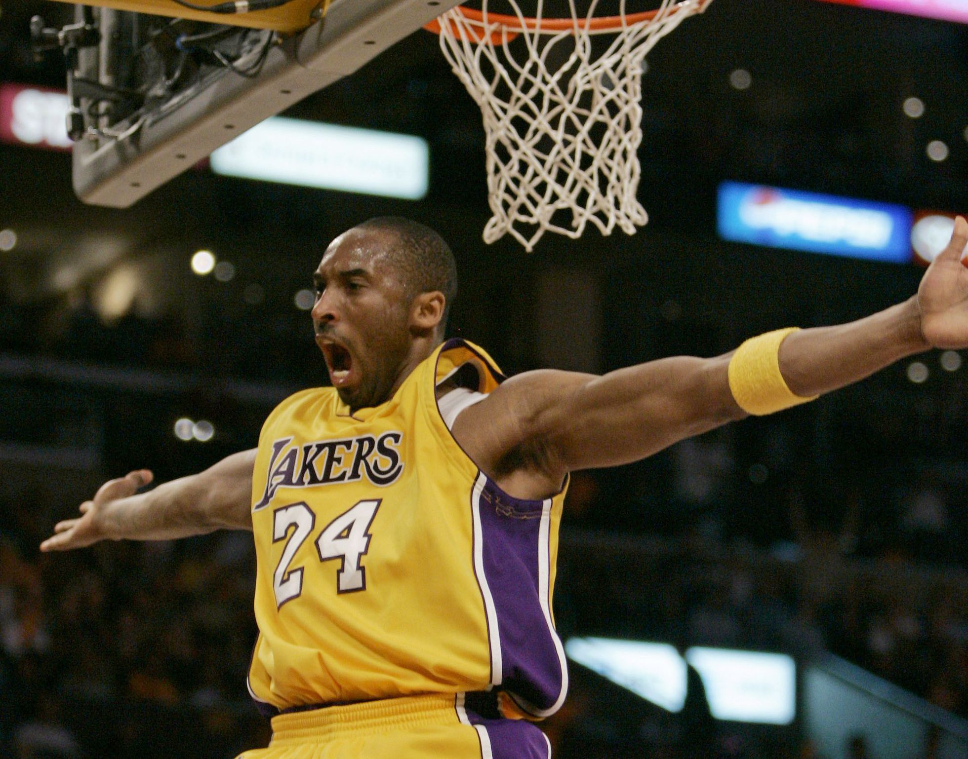 Los Angeles Lakers' Kobe Bryant celebrates a basket against the Phoenix Suns during the first half of their Western Conference playoff basketball game in Los Angeles, Thursday, April 26, 2007. (AP Photo/Chris Carlson)
