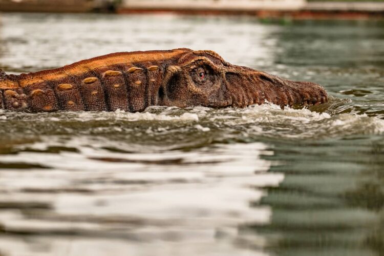 two spinosaurus on the chao phraya river in bangkok v0 iqytuveqy7af1