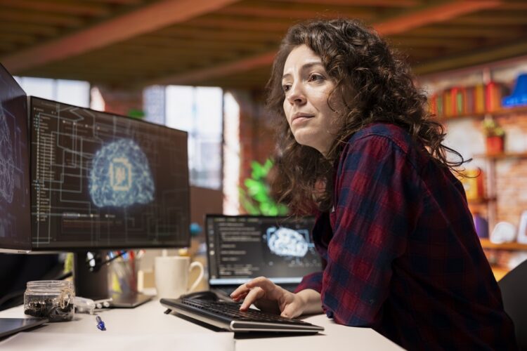 System administrator in startup office coding advanced AI algorithm and machine learning models enhancing automation. IT specialist using PC in artificial intelligence Silicon Valley workplace
